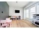 Spacious playroom with hardwood floors, lots of natural light, and stylish decor at 13933 Wildcat Dr, Carmel, IN 46033