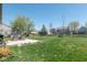 Expansive backyard offering ample green space, mature trees, and a patio, ideal for entertaining or relaxation at 13971 Bruddy Dr, Fishers, IN 46038