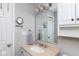 Bathroom featuring a granite vanity top, an expansive mirror, and built-in cabinets at 13971 Bruddy Dr, Fishers, IN 46038