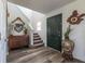 Inviting foyer featuring wood flooring, a staircase, and decorative accents enhancing the entryway's appeal at 13971 Bruddy Dr, Fishers, IN 46038