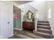 Bright foyer showcasing wood-look flooring, stairway, and stylish decor elements creating a welcoming atmosphere at 13971 Bruddy Dr, Fishers, IN 46038