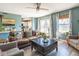 Inviting living room boasts natural light, stylish furnishings, and a seamless connection to the kitchen at 13971 Bruddy Dr, Fishers, IN 46038