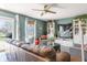 Comfortable living room features modern ceiling fan and tasteful decor, creating a welcoming space at 13971 Bruddy Dr, Fishers, IN 46038