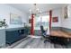 Bright office showcasing wood floors, modern lighting, a view of the backyard, and stylish decorations at 13971 Bruddy Dr, Fishers, IN 46038