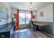 Bright office showcasing wood floors, modern lighting, and a view of the backyard at 13971 Bruddy Dr, Fishers, IN 46038
