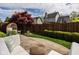 The backyard features an outdoor seating area and colorful landscaping at 15037 Rutherford Dr, Westfield, IN 46074