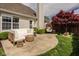 The backyard patio features stylish seating and an established shade tree at 15037 Rutherford Dr, Westfield, IN 46074