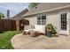 Backyard patio with white seating, privacy fence and landscaping at 15037 Rutherford Dr, Westfield, IN 46074