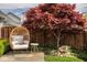 Backyard patio seating area featuring a decorative shade tree at 15037 Rutherford Dr, Westfield, IN 46074