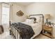 Cozy bedroom with metal frame bed, accent lighting, and decor at 15037 Rutherford Dr, Westfield, IN 46074