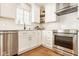 Bright kitchen showcasing white cabinetry, stainless steel appliances, and modern finishes at 15037 Rutherford Dr, Westfield, IN 46074