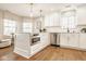 Modern kitchen with white cabinetry, stainless steel appliances, an island, and ample natural light at 15037 Rutherford Dr, Westfield, IN 46074