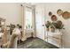 Cozy space filled with an abundance of plants, natural light, and a comfortable chair at 15037 Rutherford Dr, Westfield, IN 46074