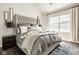 Comfortable main bedroom with tufted headboard, decorative pillows, and soft textures at 15037 Rutherford Dr, Westfield, IN 46074
