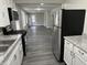 Modern kitchen offering stainless steel appliances, white cabinets, and ample counter space at 1517 N Gladstone Ave, Indianapolis, IN 46201