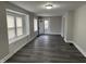 Bright living room featuring modern flooring, a bay window, and a freshly painted interior at 1517 N Gladstone Ave, Indianapolis, IN 46201