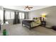 Bright bedroom featuring two windows, a ceiling fan, and neutral decor at 1520 Norfolk Dr, Zionsville, IN 46077