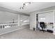 Lofted room featuring a built-in desk/office area, neutral walls, plush carpeting and skylights at 1520 Norfolk Dr, Zionsville, IN 46077