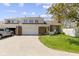 Charming brick townhouse featuring an attached garage, well-manicured lawn, and inviting curb appeal at 1520 Norfolk Dr, Zionsville, IN 46077