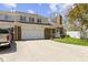 Inviting brick townhouse with attached garage, landscaped front yard, and charming details at 1520 Norfolk Dr, Zionsville, IN 46077