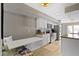 Modern kitchen with stainless steel appliances, white cabinets, and a cozy breakfast nook with banquette seating at 1520 Norfolk Dr, Zionsville, IN 46077