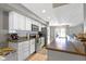 Well-lit kitchen showcasing granite countertops, stainless steel appliances, and white subway tile backsplash at 1520 Norfolk Dr, Zionsville, IN 46077