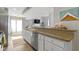 Well-appointed kitchen with a breakfast bar, stainless steel appliances, and modern finishes at 1520 Norfolk Dr, Zionsville, IN 46077