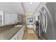 Spacious kitchen featuring a peninsula countertop, stainless steel appliances, and sleek white cabinetry at 1520 Norfolk Dr, Zionsville, IN 46077