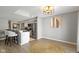 Bright kitchen and dining area with bar seating, stainless steel appliances, and light, neutral finishes at 1520 Norfolk Dr, Zionsville, IN 46077