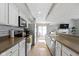 Open-concept kitchen with granite counters, stainless appliances, and a seamless flow to the living space at 1520 Norfolk Dr, Zionsville, IN 46077