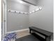 Mudroom area with a bench, coat hooks, neutral decor, and durable flooring for practical everyday use at 1520 Norfolk Dr, Zionsville, IN 46077