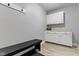 Mudroom area with overhead cabinets, a bench, and a neutral color palette for an inviting transition space at 1520 Norfolk Dr, Zionsville, IN 46077