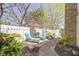Beautiful patio with loungers, brick pathway and privacy fence, perfect for outdoor relaxation at 1520 Norfolk Dr, Zionsville, IN 46077