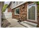 Brick patio with a privacy fence creating a cozy outdoor space with a back door entryway at 156 Aspen Way, Carmel, IN 46032