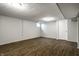 Finished basement area with modern flooring, white walls, and recessed lighting at 156 Aspen Way, Carmel, IN 46032