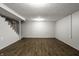Finished basement showcasing neutral walls, modern flooring, and a staircase at 156 Aspen Way, Carmel, IN 46032