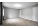 Clean, carpeted bedroom with neutral paint, large closet and trim with a single window to provide natural light at 156 Aspen Way, Carmel, IN 46032