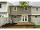 Back of home featuring deck, patio doors, and air conditioning unit at 156 Aspen Way, Carmel, IN 46032