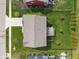 Aerial view of a home showcasing the roof, backyard with patio, landscaping, and surrounding neighborhood at 15723 Myland Dr, Noblesville, IN 46062