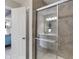 Bathroom featuring a glass enclosed shower with tile surround, and a vanity with double sinks at 15723 Myland Dr, Noblesville, IN 46062