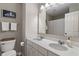 Bathroom featuring dual sinks, a large mirror, and ample counter space with a nautical theme at 15723 Myland Dr, Noblesville, IN 46062