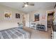 Bright bedroom featuring a ceiling fan, playful decor, and a walk-in closet at 15723 Myland Dr, Noblesville, IN 46062