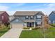 Beautiful two-story home with blue siding, a well-manicured lawn, and an attached two-car garage at 15723 Myland Dr, Noblesville, IN 46062
