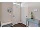 Bright foyer featuring hardwood floors, a console table, and a stylish round mirror at 15723 Myland Dr, Noblesville, IN 46062