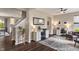 Well-lit home office featuring two desks, a comfortable chair, and an open floor plan at 15723 Myland Dr, Noblesville, IN 46062