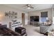 Spacious living room with comfortable seating and wall decor, illuminated by natural light at 15723 Myland Dr, Noblesville, IN 46062