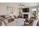 Inviting living room features a fireplace, comfortable seating, and stylish decor, ideal for entertaining at 15723 Myland Dr, Noblesville, IN 46062