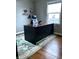 Home office featuring a large desk, comfortable chair, and natural light from the window at 1624 N Whittier Pl, Indianapolis, IN 46218