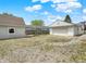 Expansive backyard featuring a detached garage, shed, and fire pit area, perfect for outdoor gatherings at 1629 N K St, Elwood, IN 46036