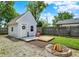 Charming backyard features a cozy shed with a deck and fire pit area, perfect for outdoor gatherings at 1629 N K St, Elwood, IN 46036